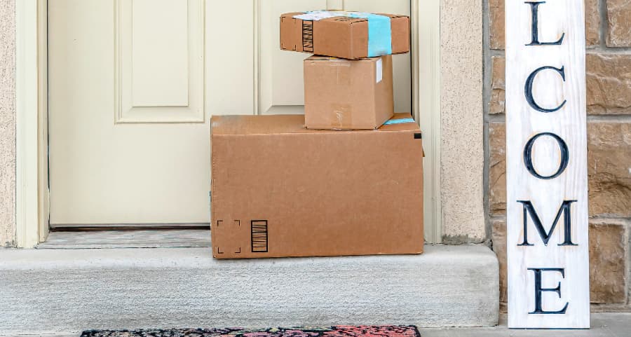 Deliveries on the front porch of a house with a welcome sign in Gulfport